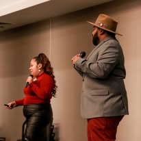 The Denmarks speaking at a training event